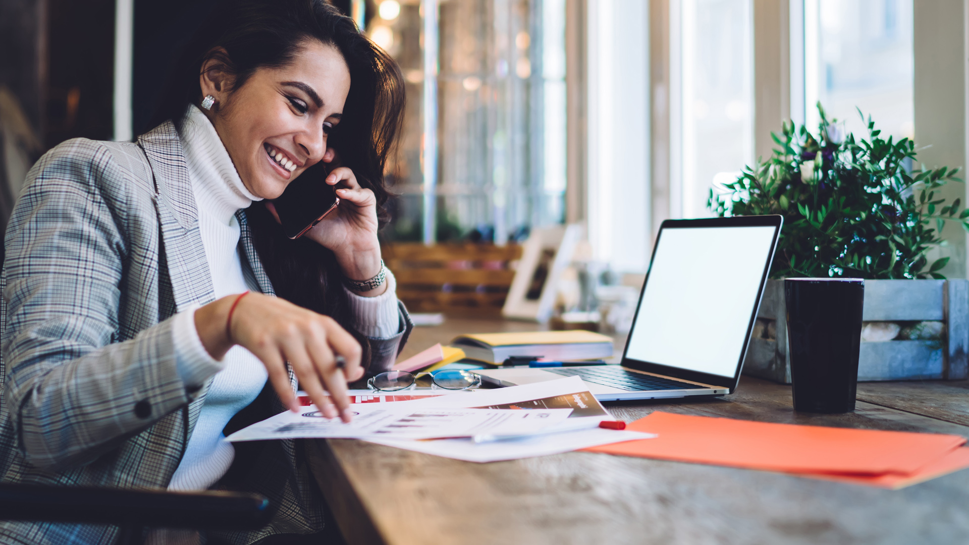 Female entrepreneur conducting business on cell phone
